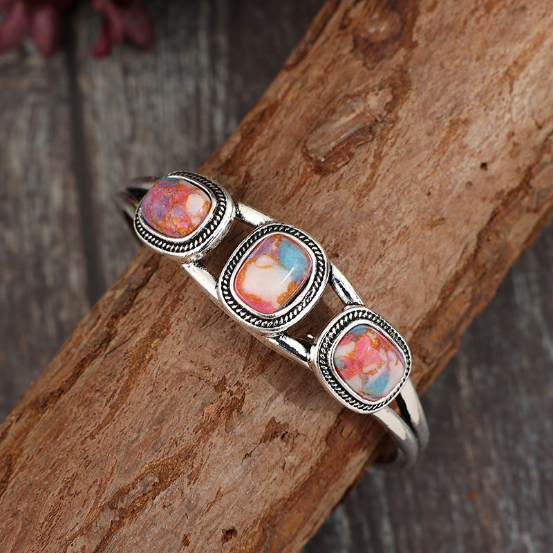 Wholesale Retro inlaid colored turquoise creative hollow pattern leaf alloy open bracelet